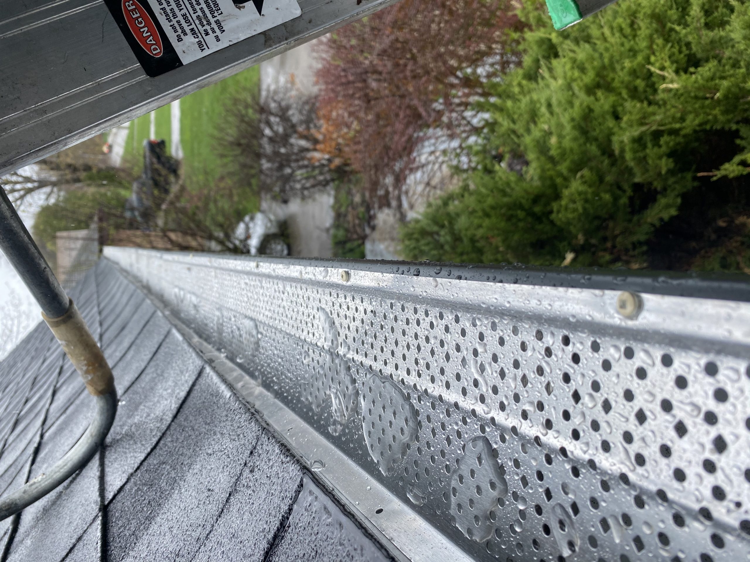 leaf guard system in eavestrough to help with soffit and fascia installation maintenance